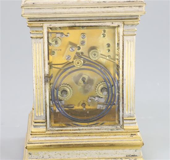 An early 20th century French silvered and parcel gilt hour repeating carriage alarum clock, 7in.